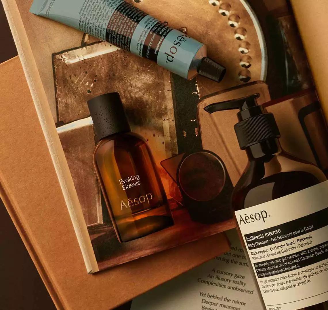 Aesop Evoking, Eidesis fragrance bottle, large pump bottle and cream tube in a box with printed materials.