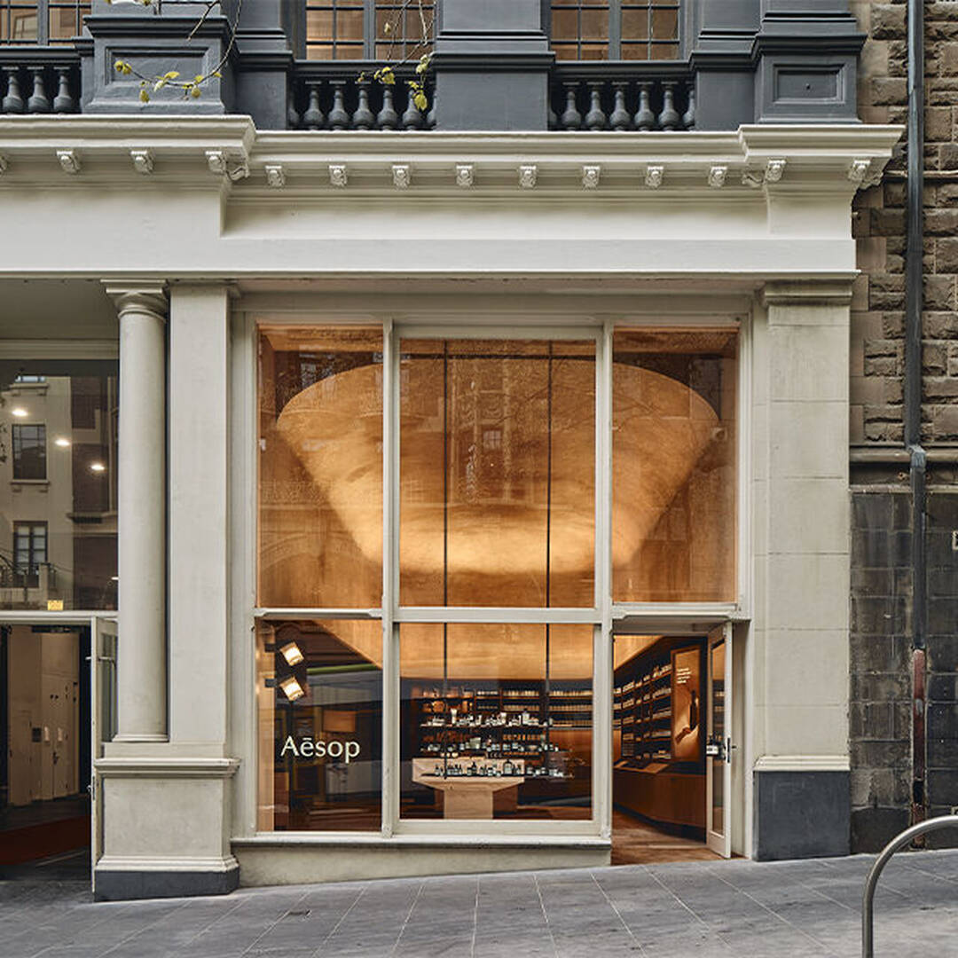 Aesop store exterior with a glowing sculptural interior
