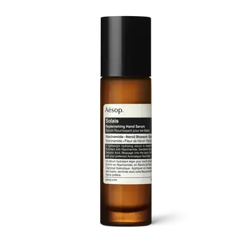 Solais Replenishing Hand Serum in a glass bottle.