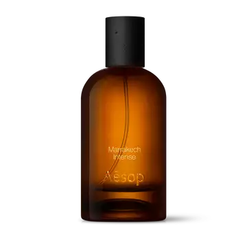 Amber glass Aesop Marrakech Intense Eau de Parfum bottle with black cap on a white background.
